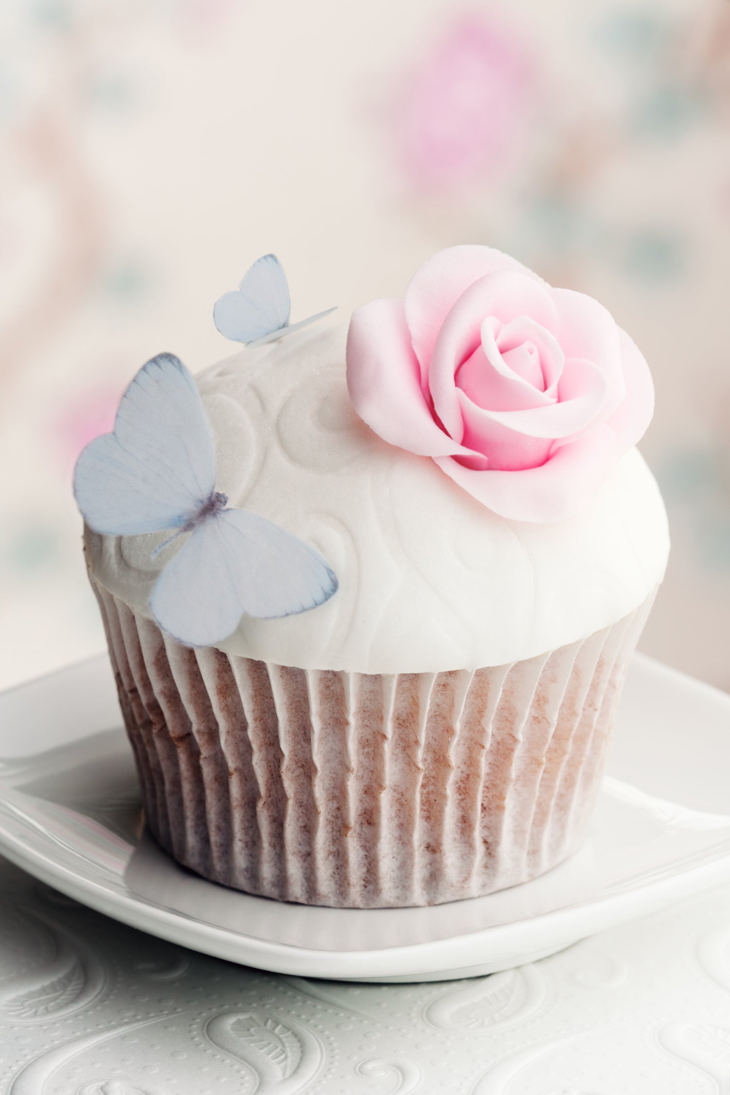 pastel blue wafer butterfly on cupcake